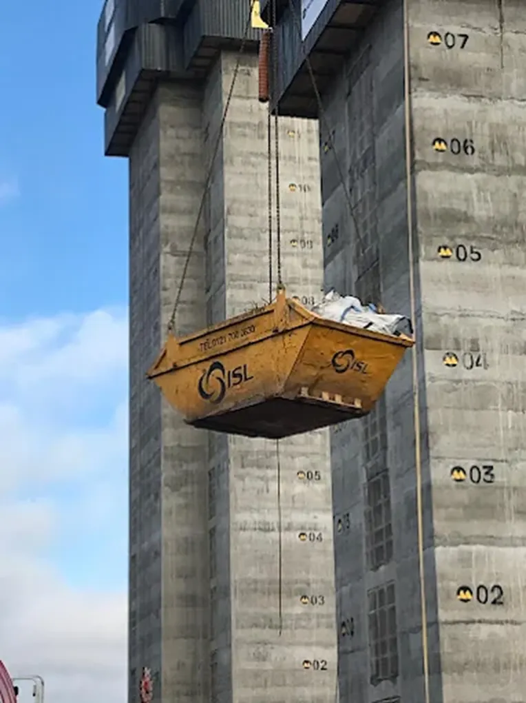 Skip loaded with construction and household waste during home improvement project